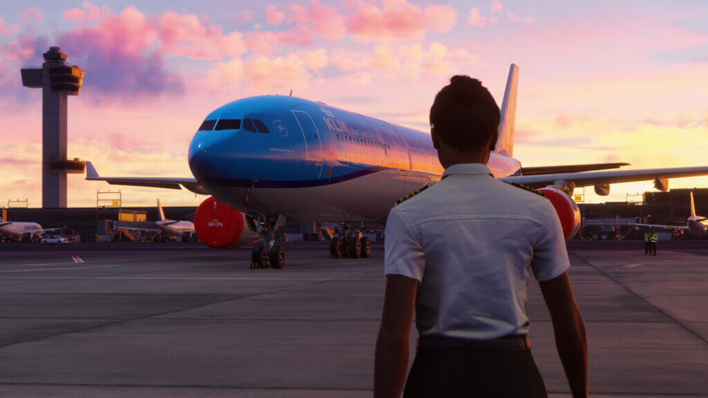 Activate to expand image of A pilot in white shirt walks towards an Airbus A330 airliner in KLM paint scheme, parked on an international airport apron